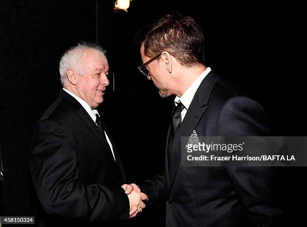 Director Jim Sheridan and honoree Robert Downey Jr. Attend the BAFTA Los Angeles Jaguar Britannia Awards presented by BBC America and United Airlines...