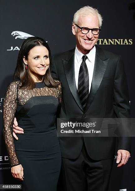 Julia Louis-Dreyfus and Brad Hall arrive at the BAFTA Los Angeles Jaguar Britannia Awards held at The Beverly Hilton Hotel on October 30, 2014 in...