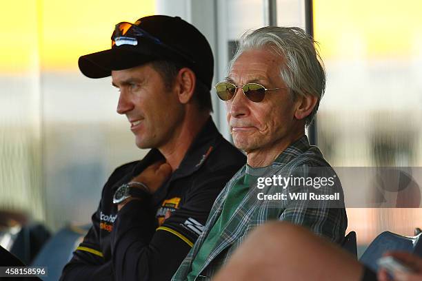 Charlie Watts of the Rolling Stones watches the action from the players pavilion with Western Australian coach Justin Langer during day one of the...