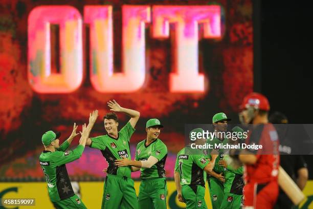 Stars players celebrate the dismissal of Ben Rohrer of the Renegades by Jackson Bird during the Big Bash League match between the Melbourne Stars and...