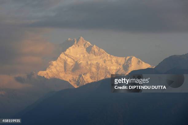 Mount Kangchenjunga is seen from Pelling in India's Sikkim state on December 19, 2013. Kangchenjunga is the world's third highest mountain at 8,586...