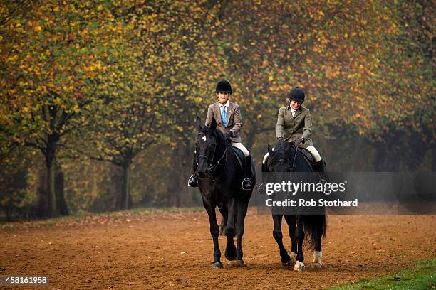 Horse riders walk through Hyde Park on October 31, 2014 in London, England. Temperatures in London are forecasted to exceed 20 degrees, making today...