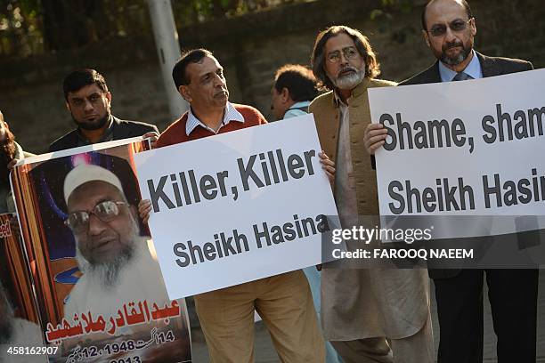 Pakistani civil society and Jamaat-e-Islami party activists protest outside the Bangladeshi embassy in Islamabad on December 20 against the execution...