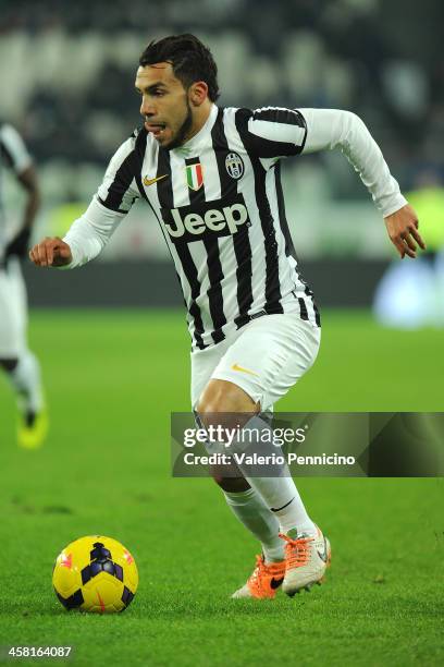 Carlos Tevez of Juventus in action during the Serie A match between Juventus and US Sassuolo Calcio at Juventus Arena on December 15, 2013 in Turin,...