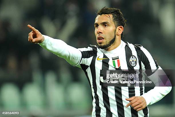 Carlos Tevez of Juventus celebrates his second goal during the Serie A match between Juventus and US Sassuolo Calcio at Juventus Arena on December...