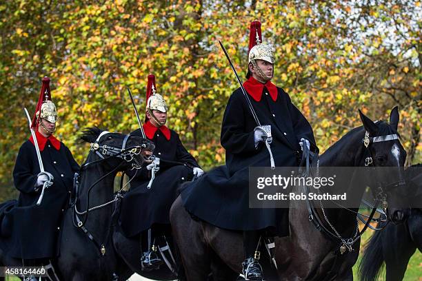 The Household Cavalry Mounted Regiment walk along Knightsbridge on October 31, 2014 in London, England. Temperatures in London are forecasted to...