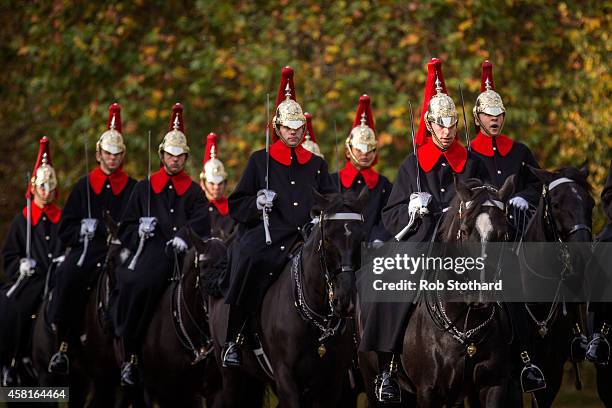 The Household Cavalry Mounted Regiment walk along Knightsbridge on October 31, 2014 in London, England. Temperatures in London are forecasted to...