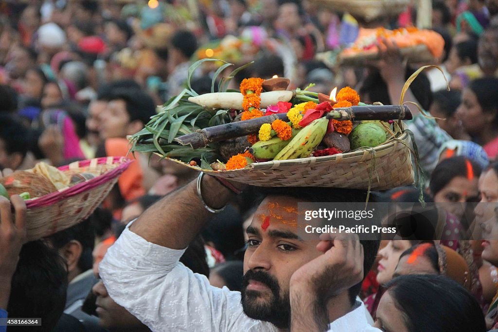 Hindu devotees gather in river Yamuna to perform rituals to...
