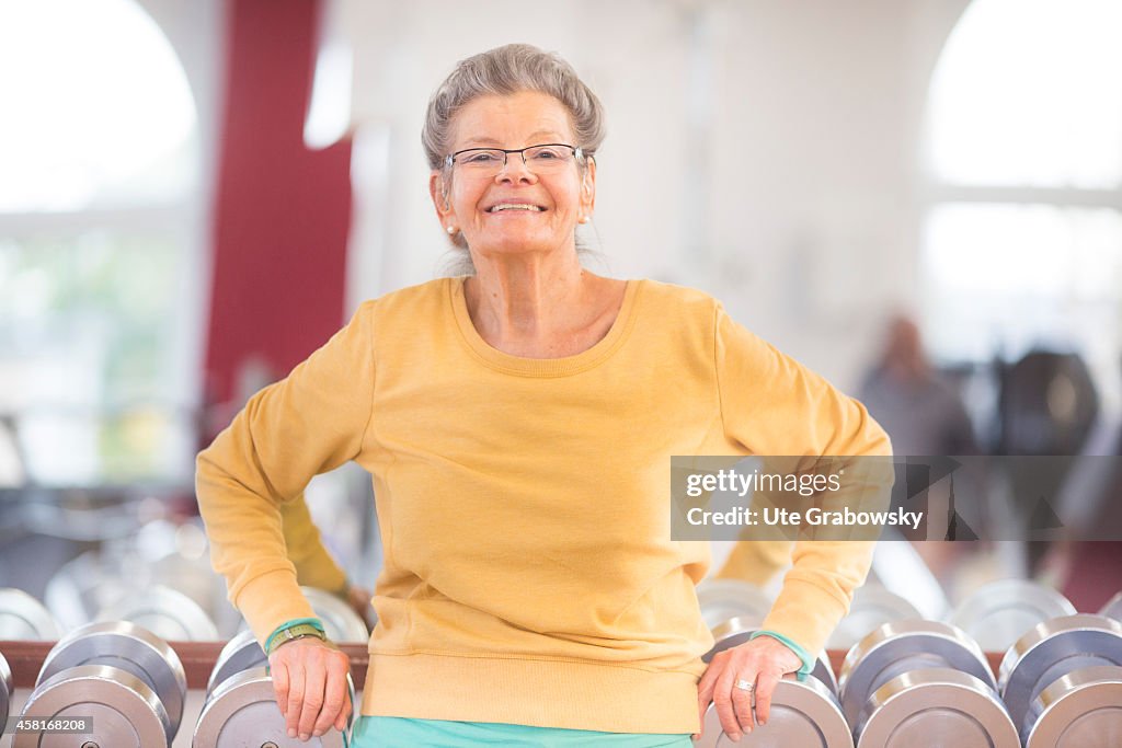 Senior Woman Exercising In A Gym