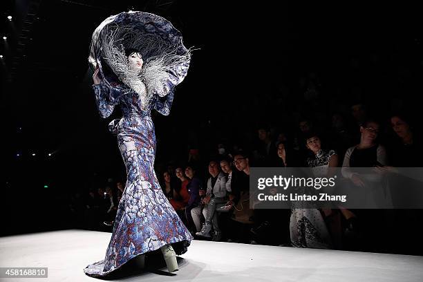 Model showcases designs on the runway at HEYUANCIYE Hu Sheguang Collection show during day seven of Mercedes-Benz China Fashion Week Spring/Summer...