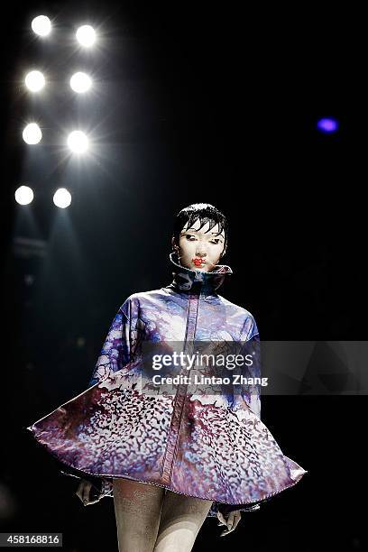 Model showcases designs on the runway at HEYUANCIYE Hu Sheguang Collection show during day seven of Mercedes-Benz China Fashion Week Spring/Summer...