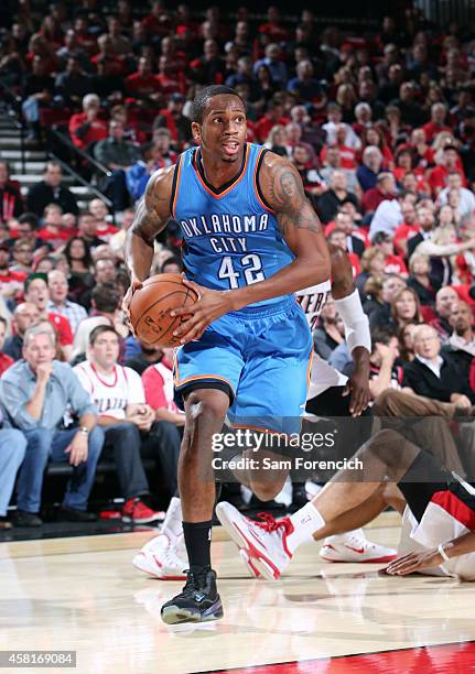 Lance Thomas of the Oklahoma City Thunder drives against the Portland Trail Blazers on October 29, 2014 at the Moda Center Arena in Portland, Oregon....