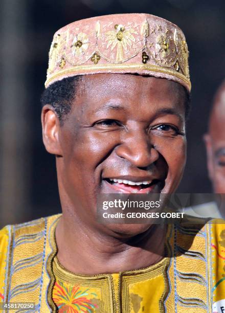 Burkina Faso president Blaise Compaoré leaves the pitch of the stadium after giving the Golden Stallion of Yennenga for best film at the Pan-African...