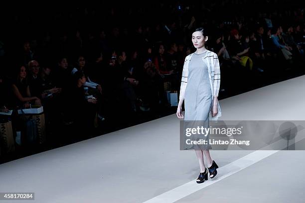 Model showcases designs on the runway at HUI Zhao Huizhou Collection show during day seven of Mercedes-Benz China Fashion Week Spring/Summer 2015 at...