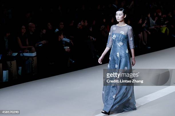 Model showcases designs on the runway at HUI Zhao Huizhou Collection show during day seven of Mercedes-Benz China Fashion Week Spring/Summer 2015 at...