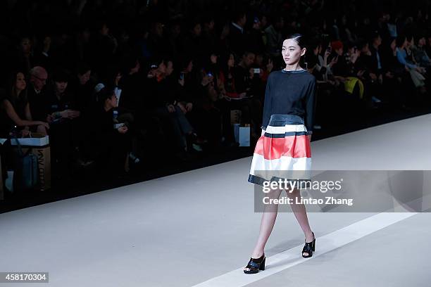 Model showcases designs on the runway at HUI Zhao Huizhou Collection show during day seven of Mercedes-Benz China Fashion Week Spring/Summer 2015 at...