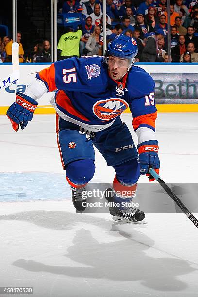 Cal Clutterbuck of the New York Islanders skates against the Toronto Maple Leafs at Nassau Veterans Memorial Coliseum on October 21, 2014 in...