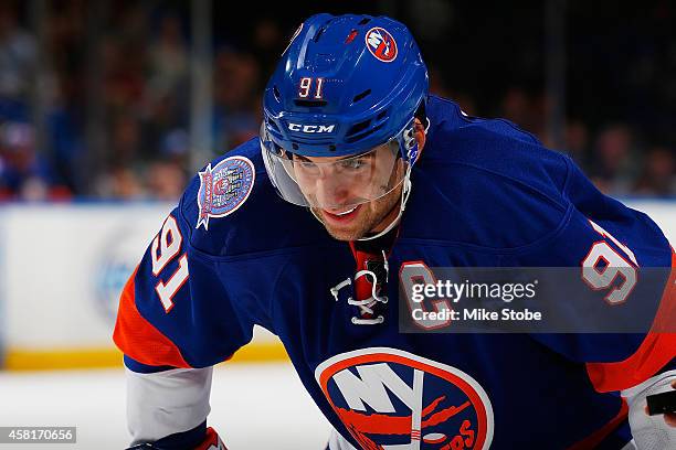 John Tavares of the New York Islanders skates against the Toronto Maple Leafs at Nassau Veterans Memorial Coliseum on October 21, 2014 in Uniondale,...