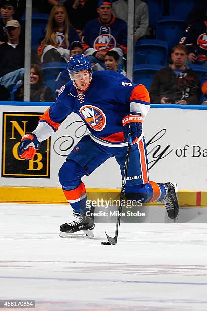 Travis Hamonic of the New York Islanders skates against the Toronto Maple Leafs at Nassau Veterans Memorial Coliseum on October 21, 2014 in...
