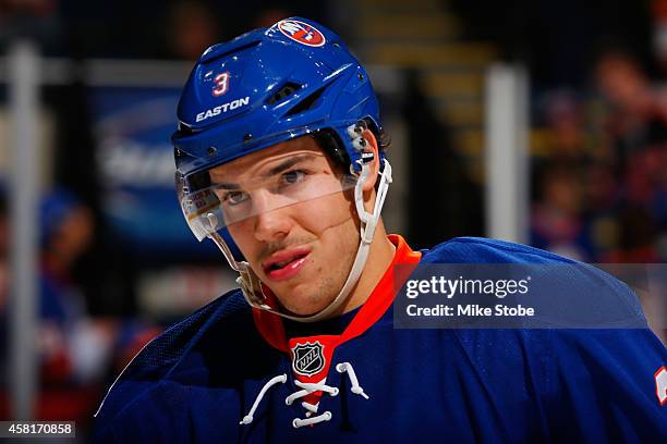 Travis Hamonic of the New York Islanders skates against the Toronto Maple Leafs at Nassau Veterans Memorial Coliseum on October 21, 2014 in...