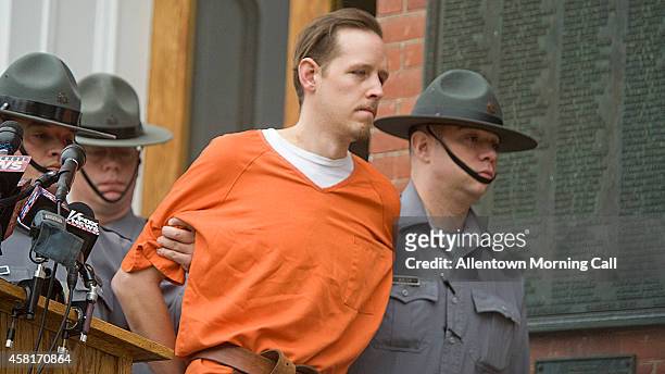 Eric Frein is escorted from his arraignment in the Pike County Courthouse on Friday, Oct. 31, 2014 in Milford, Pa.