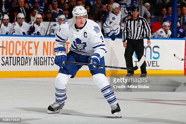 Dion Phaneuf of the Toronto Maple Leafs skates against the New York Islanders at Nassau Veterans Memorial Coliseum on October 21, 2014 in Uniondale,...