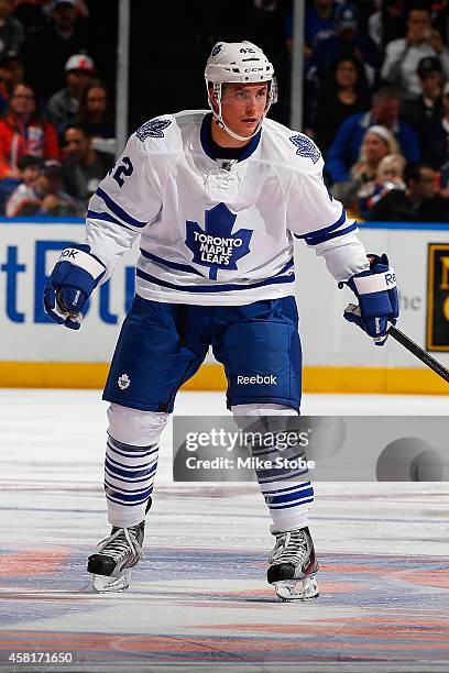 Tyler Bozak of the Toronto Maple Leafs skates against the New York Islanders at Nassau Veterans Memorial Coliseum on October 21, 2014 in Uniondale,...