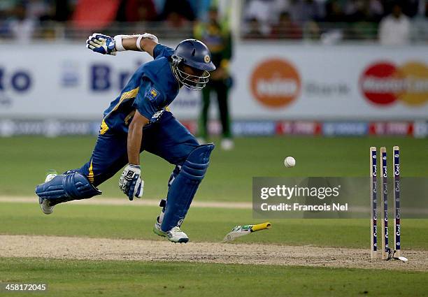 Dilshan of Sri Lanka is run out during the second One-Day International match between Sri Lanka and Pakistan at the Dubai Sports City Cricket Stadium...