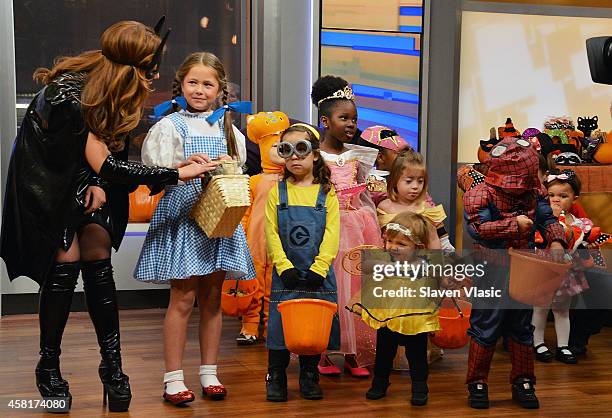 Friends" co-host Maria Molina as Bat Girl and guests attend "FOX & Friends'" 2014 Halloween Celebration at FOX Plaza on October 31, 2014 in New York...