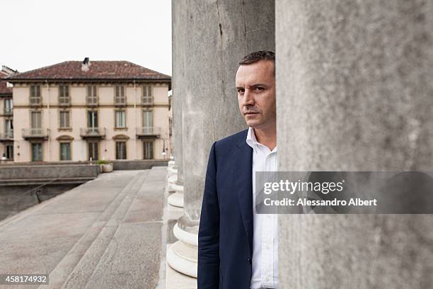 Actor and his wife Andrea Zalone, Germana Pasquero is photographed for Famiglia Cristiana Italy on May 23, 2014 in Turin, Italy.