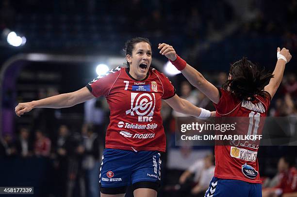 Serbia's Andrea Lekic and Sanja Damnjanovic celebrate after scoring during the 2013 Women's Handball World Championship semi-final match between...