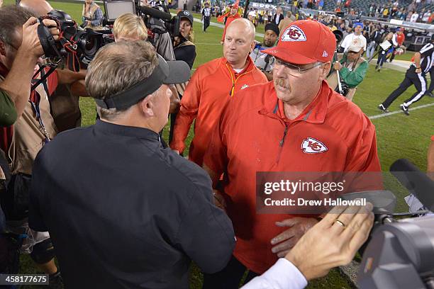 Head coach Chip Kelly of the Philadelphia Eagles and head coach Andy Reid of the Kansas City Chiefs shake hands ager the game at Lincoln Financial...