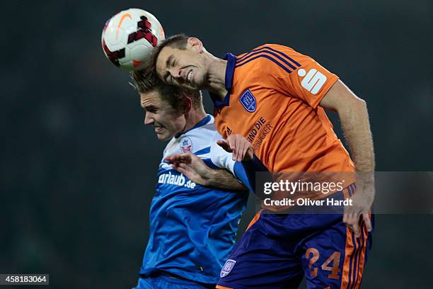 Dennis Srbeny of Rostock and Tobias Willers of Osnabrueck compete for the ball between the 3 Liga Hansa Rostock and VfL Osnabrueck during the at...