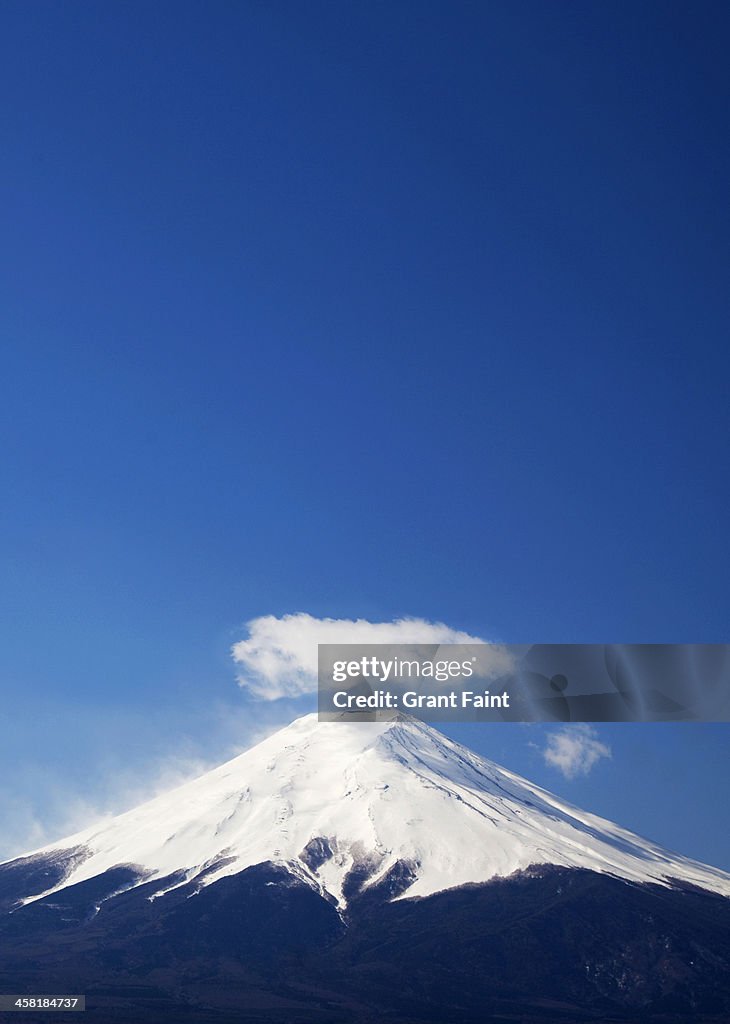 Huge mountain with funny looking cloud