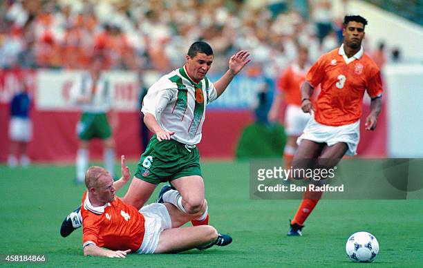 Holland player Ronald Koeman tackles Roy Keane as Frank Rijkaard looks on during the FIFA World Cup match between the Netherlands and Republic of...
