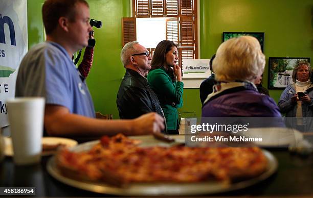 Democratic Senate candidate and Kentucky Secretary of State Alison Lundergan Grimes speaks to supporters inside Buddy's Pizza during a campaign stop...