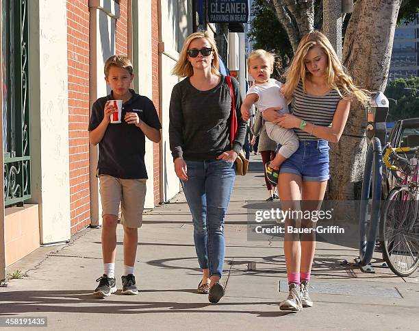 Reese Witherspoon with her children, Deacon Phillippe, Ava Phillippe and Tennessee Toth are seen on December 20, 2013 in Los Angeles, California.