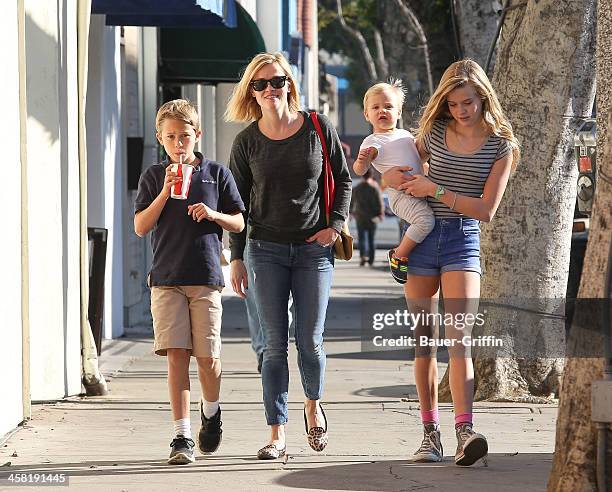 Reese Witherspoon with her children, Deacon Phillippe, Ava Phillippe and Tennessee Toth are seen on December 20, 2013 in Los Angeles, California.