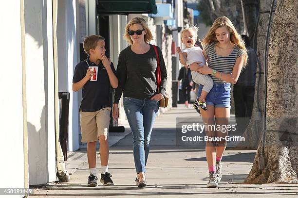 Reese Witherspoon with her children, Deacon Phillippe, Ava Phillippe and Tennessee Toth are seen on December 20, 2013 in Los Angeles, California.