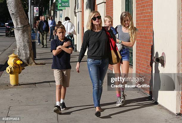 Reese Witherspoon with her children, Deacon Phillippe, Ava Phillippe and Tennessee Toth are seen on December 20, 2013 in Los Angeles, California.