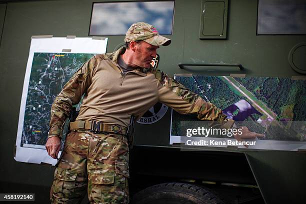 Scott Malkowski, Task Force Commander, US Marshals Service, Special Operations Group, show the map of the operation in which they captured Eric...