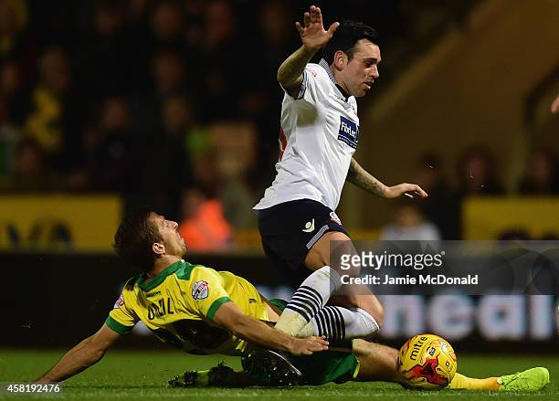 Gary O'Neil of Norwich City tackles Mark Davies of Bolton during the Sky Bet Championship match between Norwich City and Bolton Wanderers at Carrow...
