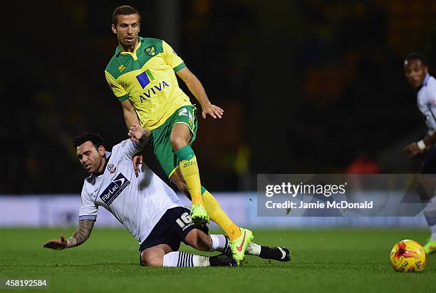 Gary O'Neil of Norwich City tackles Mark Davies of Bolton during the Sky Bet Championship match between Norwich City and Bolton Wanderers at Carrow...