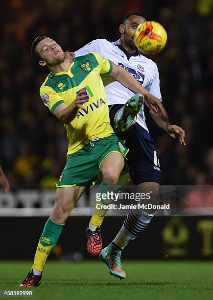 Jonny Howson of Norwich City battles with Liam Trotter of Bolton during the Sky Bet Championship match between Norwich City and Bolton Wanderers at...
