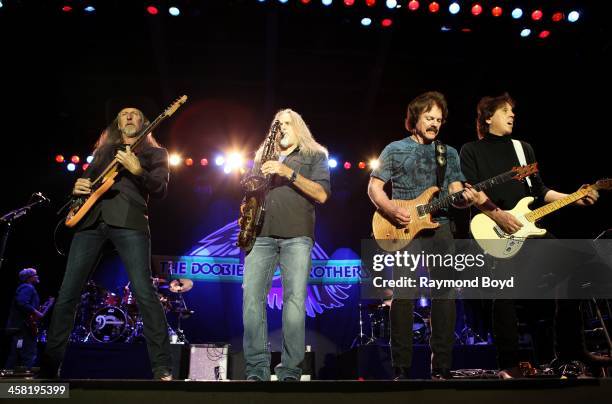 Patrick Simmons, Marc Russo, Tom Johnston and John McFee of the Doobie Brothers, performs on the Briggs & Stratton Big Backyard Stage at the Henry W....