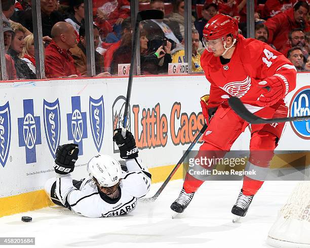 Gustav Nyquist of the Detroit Red Wings trips Mike Richards of the Los Angeles Kings in the second period during a NHL game on October 31, 2014 at...