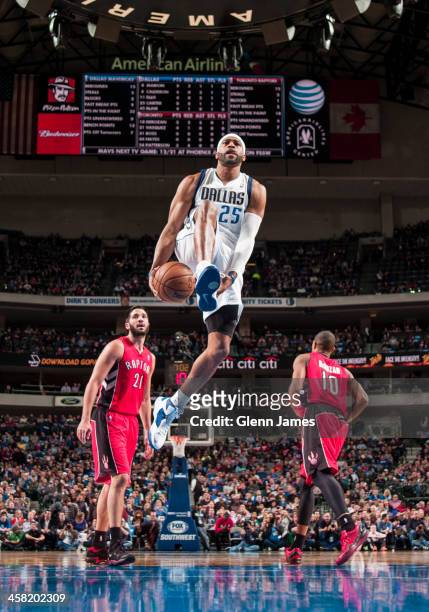 Vince Carter of the Dallas Mavericks goes in for the dunk against the Toronto Raptors on December 20, 2013 at the American Airlines Center in Dallas,...
