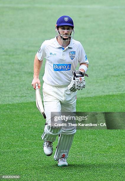 Peter Nevill of the Blues comes off the field after being caught off the bowling of John Hastings of the Bushrangers during day two of the Sheffield...