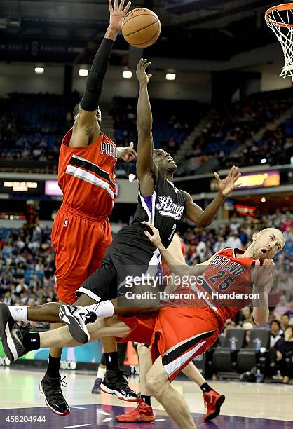 Darren Collison of the Sacramento Kings drives on Steve Blake of the Portland Trail Blazers and gets called for an offensive foul during the first...