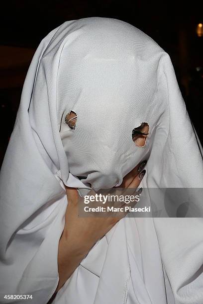 Singer Lady Gaga signs autographs as she arrives at the 'Bristol' hotel with a Halloween costume on November 1, 2014 in Paris, France.